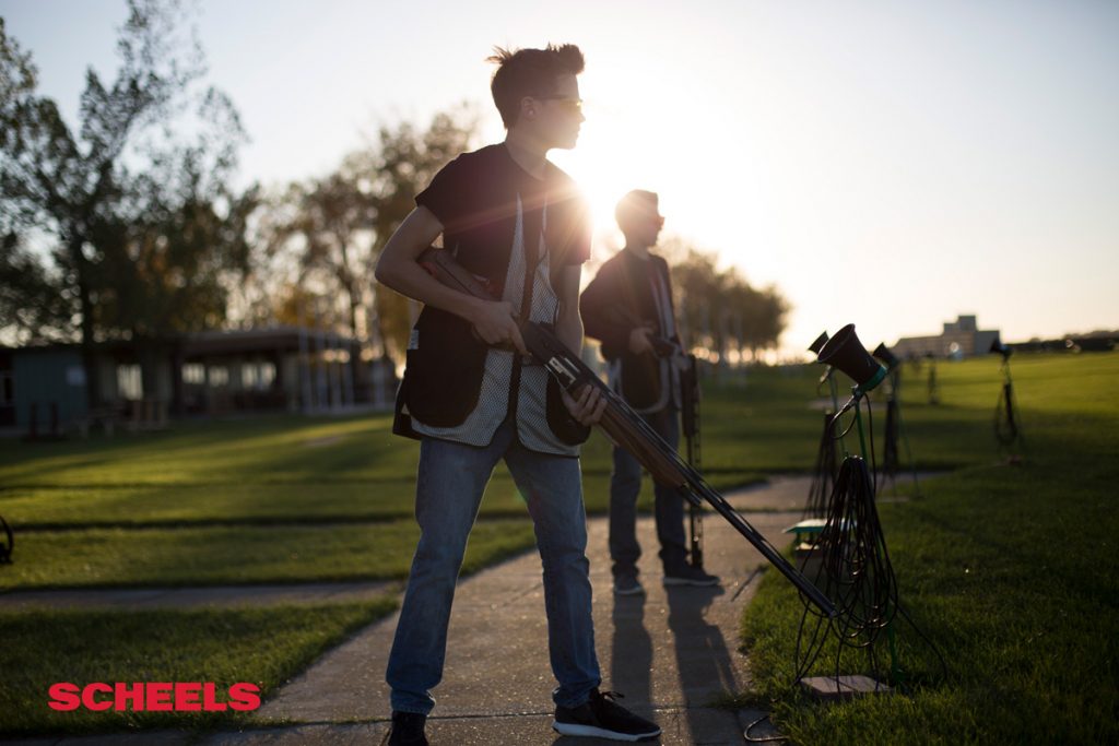 Two young men are practicing shooting.